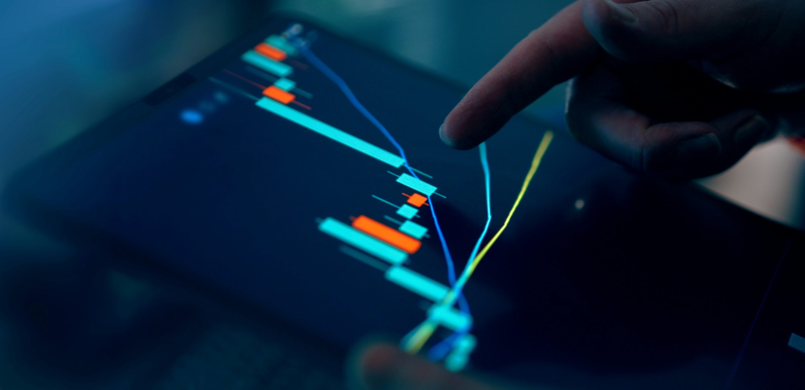 A computer screen displaying complex financial risk metrics and real-time graphs, illustrating AI's role in optimizing risk and preventing drawdown in proprietary trading.