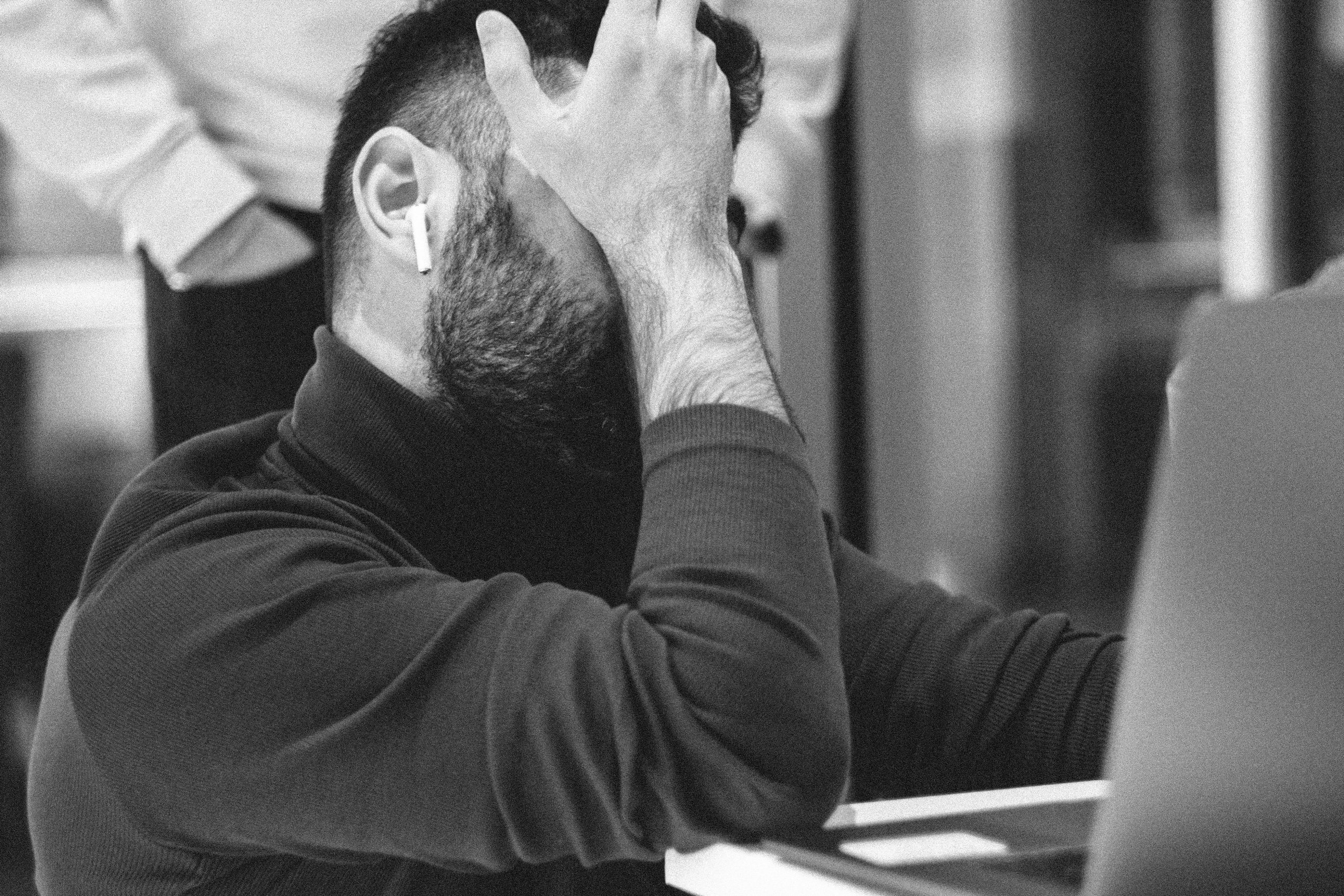 Hidden Rules in Contracts A person examining a contract with a magnifying glass, illustrating the need to carefully scrutinize prop firm terms and conditions for hidden pitfalls.